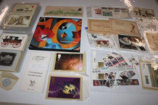 A box containing various stamps and cigarette card