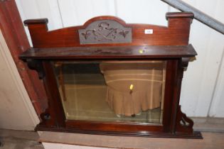 An Edwardian carved mahogany over mantel mirror