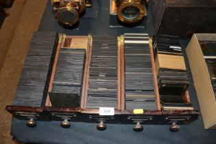 Five wooden drawers containing various slides to i