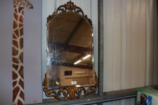 A gilt and bevel edged wall mirror