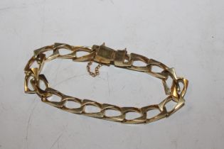 A yellow metal bracelet, marks indistinct, approx.