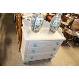 A painted pine chest fitted three drawers