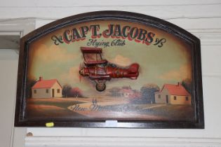 A Captain Jacobs Flying Club sign