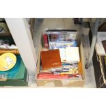 A box containing various artists materials to incl