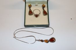 A 925 silver and amber necklace, ring and pair of