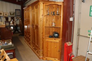 A stripped pine freestanding corner cupboard