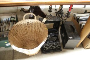 A four branch candelabra; a portable typewriter; a