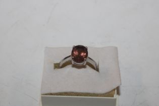 A Sterling silver and golden topaz ring, ring size