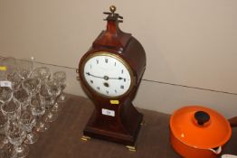 A mahogany cased balloon shaped mantel clock by Dw