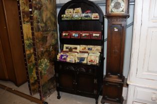 An oak dresser with arched top