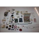 A box of jewellery beads, pendants and charms