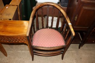 An early 20th Century tub shaped low armchair