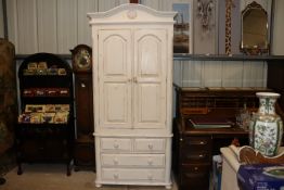 A white painted wardrobe with chest of two short a