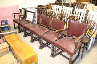 A set of six oak and leather upholstered chairs co