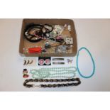 A box of various costume jewellery