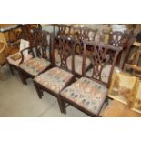A set of six carved mahogany Chippendale style din