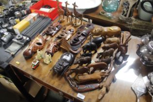 A collection of various carved wooden items includ