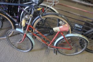 A child's Rodeo bicycle with front and rear mudgua