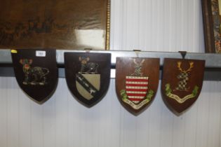 Four heraldic shields