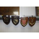 Four heraldic shields