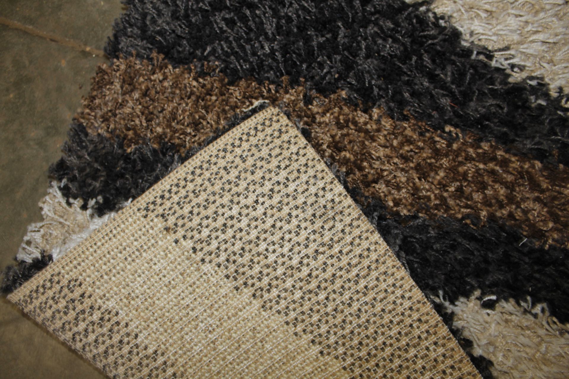 A black, white and brown patterned wool rug approx - Image 3 of 3