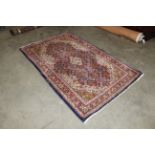 An eastern floral patterned rug approx. 218 x 135c