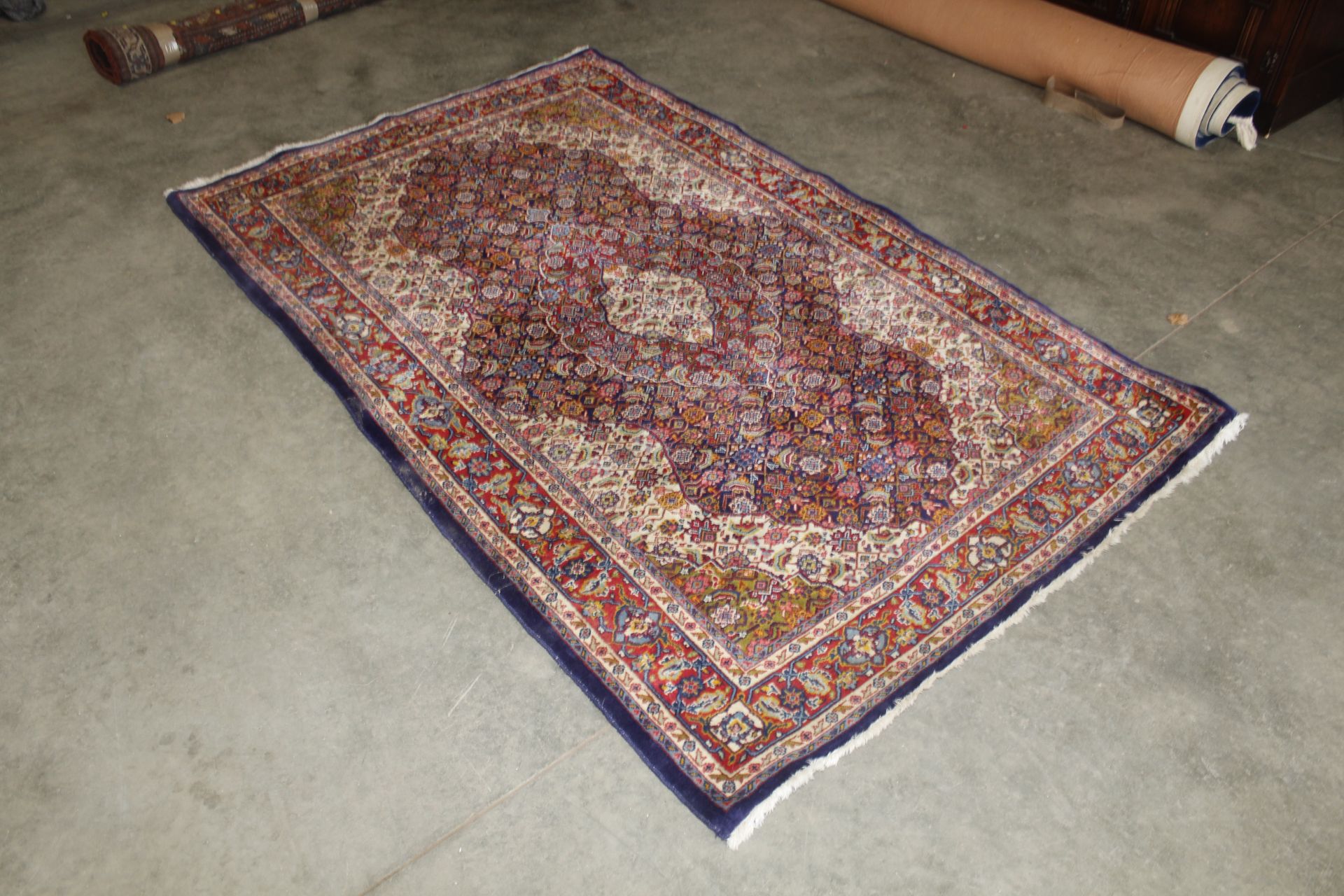 An eastern floral patterned rug approx. 218 x 135c