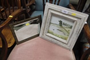 A brass framed bevelled edged wall mirror and a sm