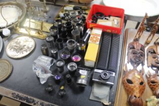 A collection of various camera lenses and accessor