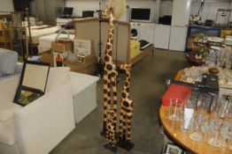 Three graduated wooden giraffe ornaments