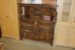 A reproduction oak court cupboard