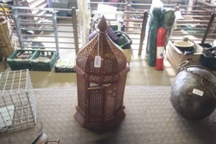 A hanging pierced metal Moroccan style lantern (36