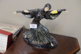 An Art Deco style figurine of a dancing girl