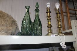 A pair of brass table lamps converted from candle