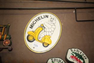 A painted cast iron sign of the Michelin Man on sc