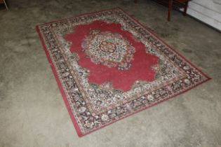 A floral patterned rug AF approx. 7'7" x 5'4"