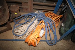 An electrical extension lead and two bundles of ro