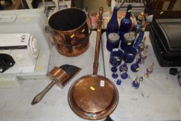 An antique copper pail with iron swing handle, cop