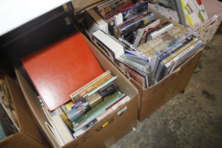 Two boxes containing various books, CDs etc.
