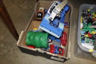 A box of various toy vehicles etc.