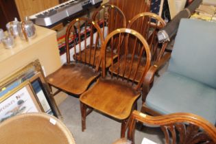 A set of four Ercol stick back kitchen chairs