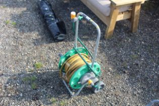 A Hozelock hose reel on trolley base with length o