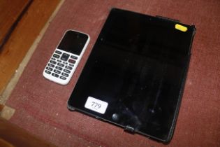 An Apple iPad (Serial Number DN6H275MDFJ1 Model Number A1396) and a Doro mobile phone