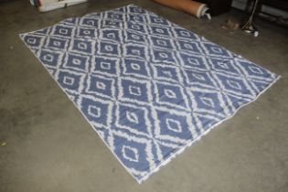 A large blue and cream cotton rug approx. 9'2" x 6