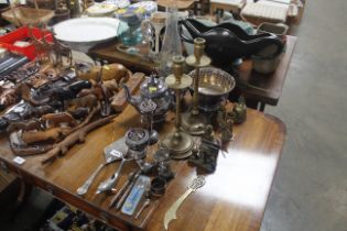 An oil lamp, a pair of brass candlesticks, plated