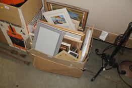 A box of miscellaneous picture frames and prints e