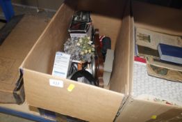 A box of miscellaneous items including barometer,