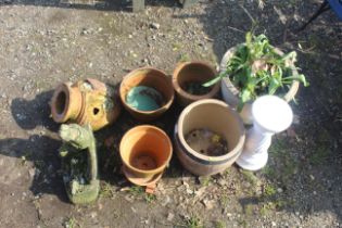 A quantity of various terracotta plant pots; garde