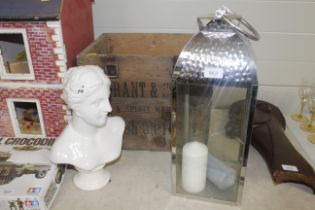 A candle lantern, an advertising box for B Grant a