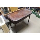 A 19th Century mahogany fold over card table (AF)